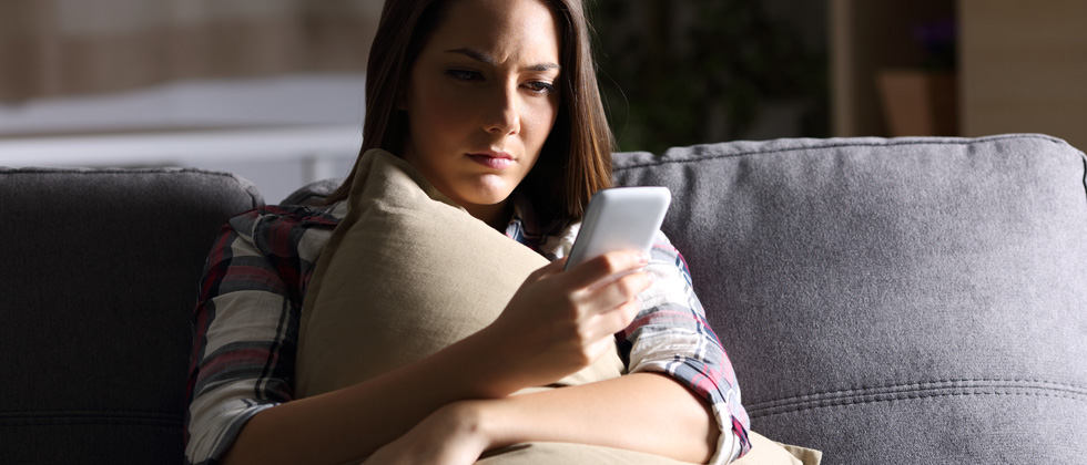 Woman looks thoughtful and thinks "should I break up with my boyfriend?"