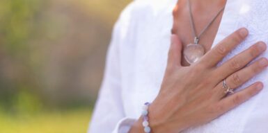 Calming image of a woman holding her hand over her heart