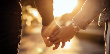 Man and woman holding hands