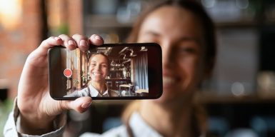 Women shows phone for eharmony features
