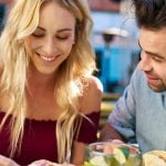 Young couple in a restaurant as a first date idea