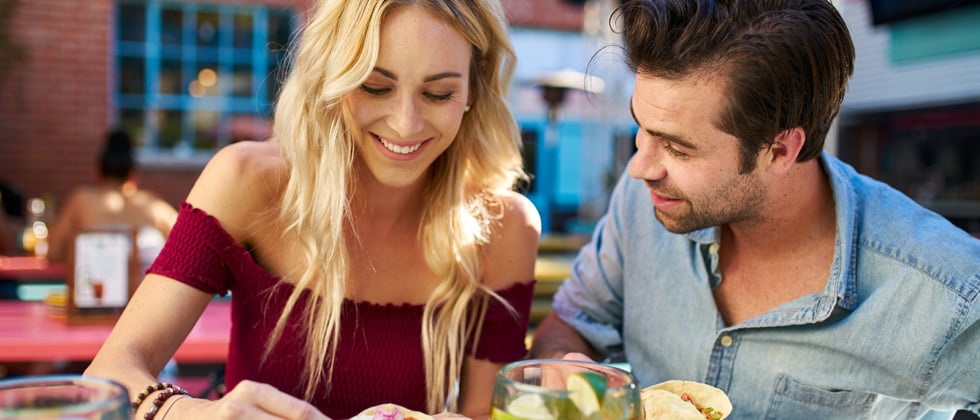 Cute couple having a coffee date gazing into each other's eyes