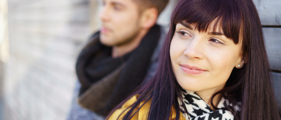 Woman looks back at man and thinks "is he interested?"