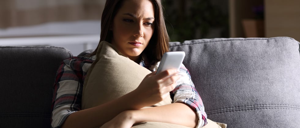 Woman looks thoughtful and thinks "should I break up with my boyfriend?"