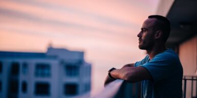 man looking into the vastness from a tower when he pulls away