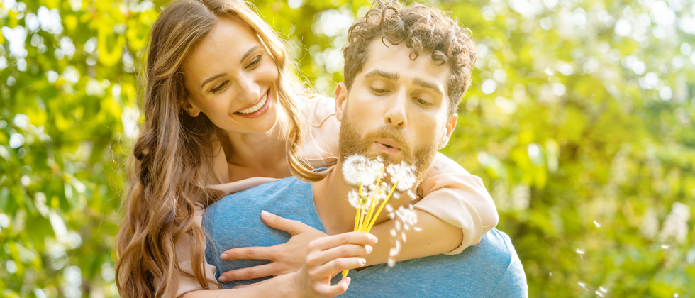 Woman hugs man as symobl for how to make women fall in love