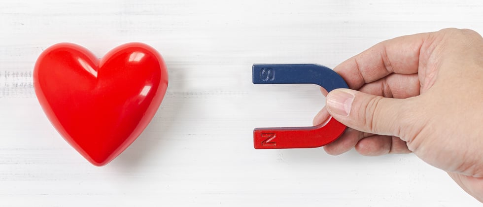 A magnetic pulling a heart towards it