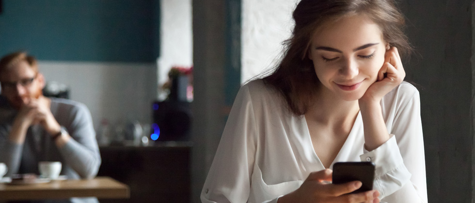 single woman looking on her phone