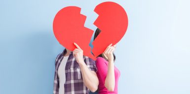 couple behind a broken heart not showing their faces