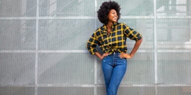 A confident fashionable woman posing and looking off to the side