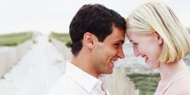 Older man and younger woman have faces leaning against each other as example of loyalty in relationship