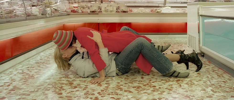 Man and woman lying on the floor as an example of should kiss on first date