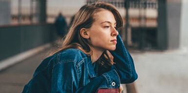 Woman looking thoughtfully into distance as symbol for flaky person