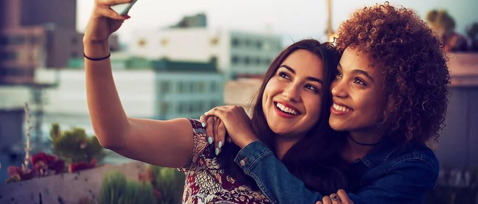 Two woman making a photo together