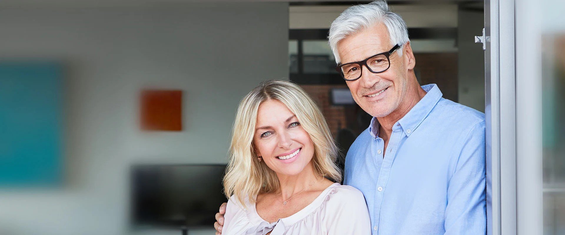 couple over 60 smiling into camera as a symbol of dating over 60