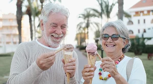 A couple enjoing ice cream together.