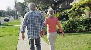 A couple strolling around the neighborhood. (Generated with AI)