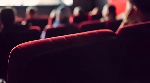 Red seats in a movie theatre.