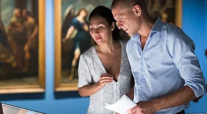 A couple looking at art together.