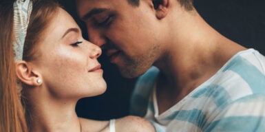 A young couple having an intimate moment together before they kiss