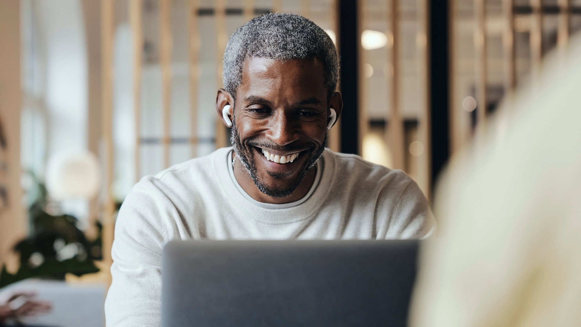 Happy Single in front of his laptop using eharmony.