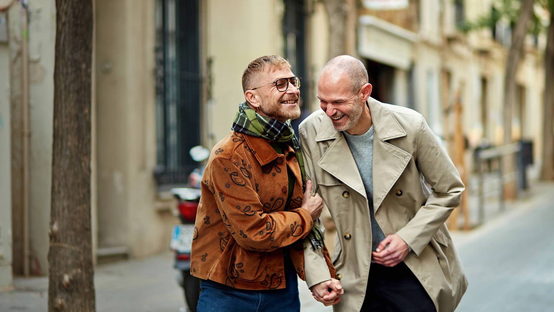 A gay couple walking through the streets of london.
