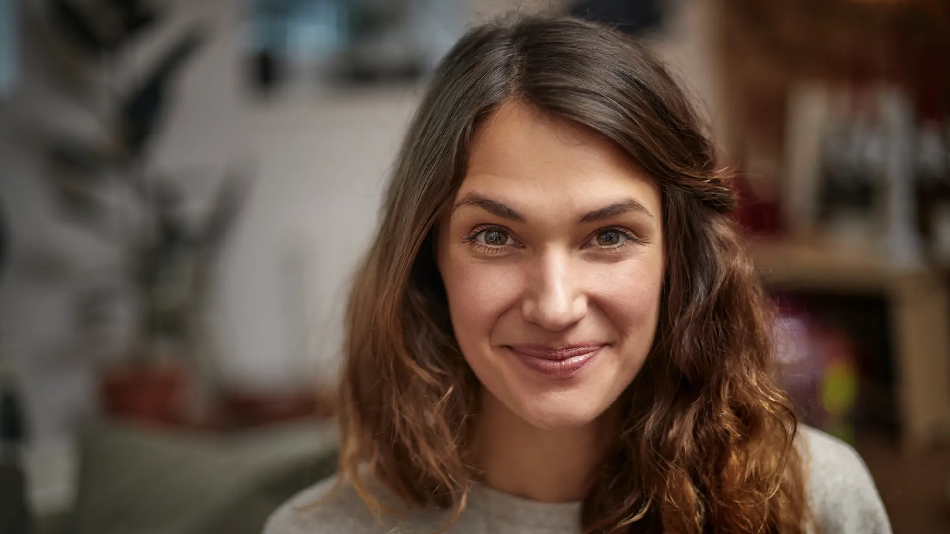 A women in her 30s looking directly in the camera