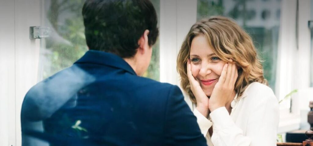 Two christian singles on a date look at each other